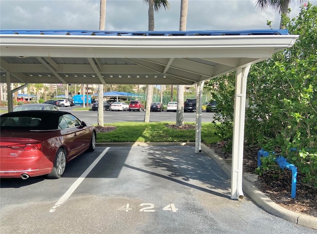 view of vehicle parking featuring a carport