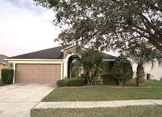 ranch-style home with a garage