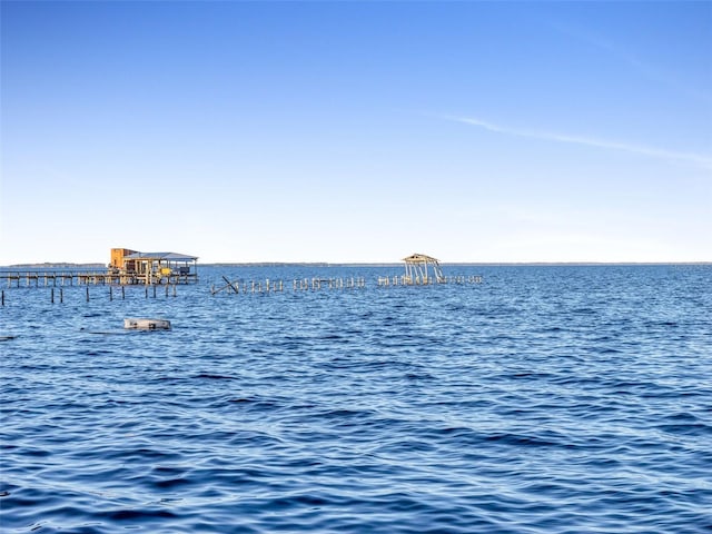 property view of water featuring a boat dock