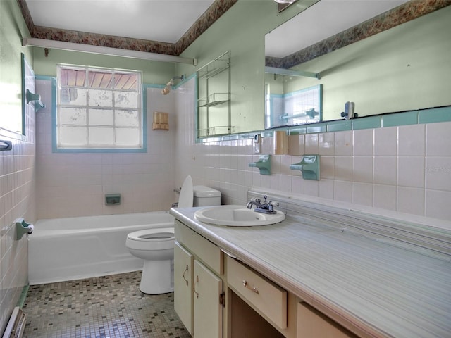 full bathroom with tile patterned floors, a wealth of natural light, vanity, and tile walls