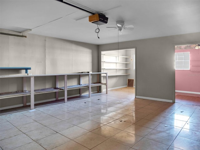 garage with a garage door opener and ceiling fan