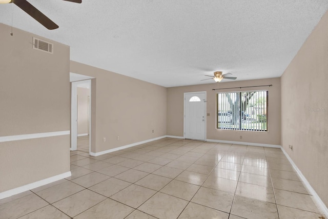 interior space featuring ceiling fan and light tile patterned floors