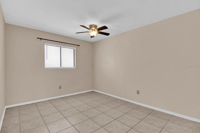 tiled spare room with ceiling fan