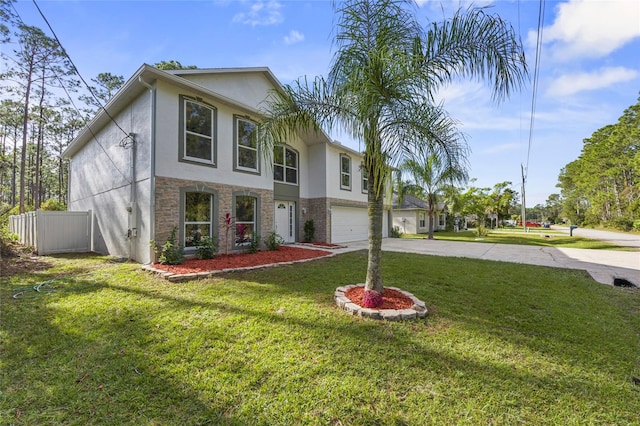 view of front of property with a garage and a front lawn