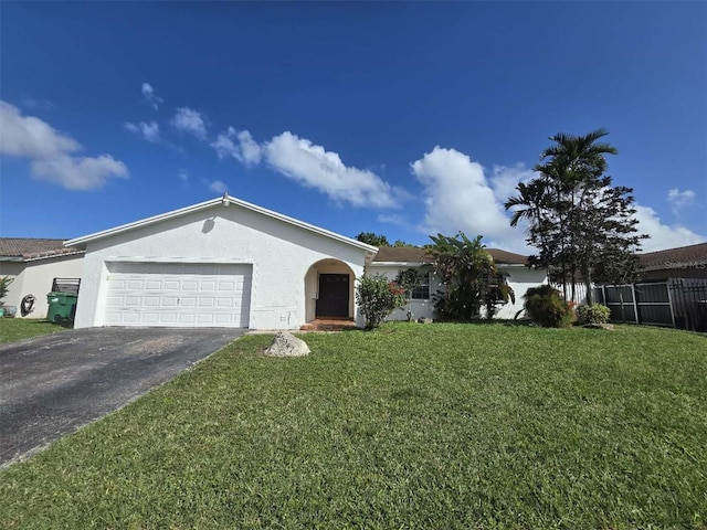 single story home with a front lawn and a garage