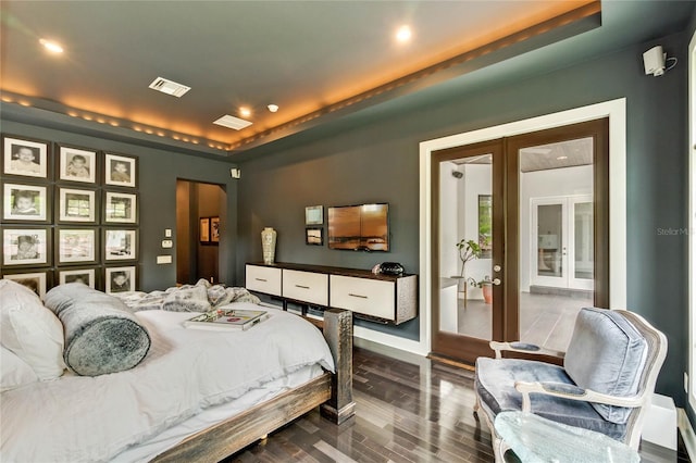 bedroom with wood-type flooring and french doors