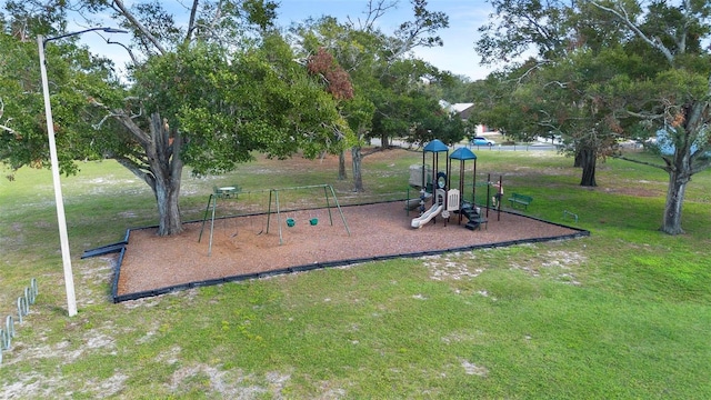 view of playground featuring a lawn