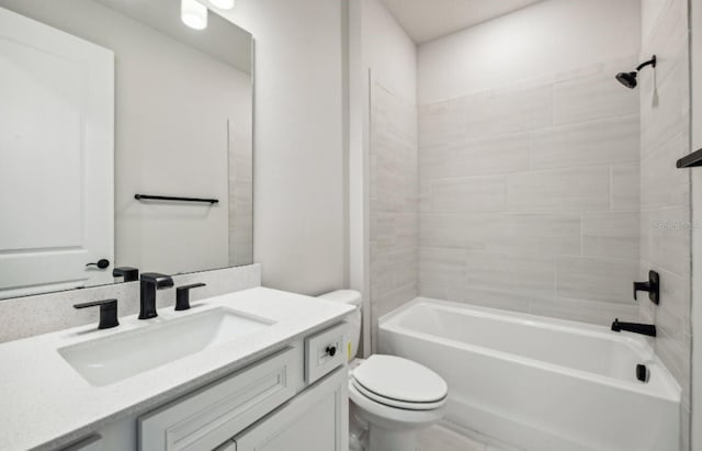 full bathroom with vanity, toilet, and tiled shower / bath