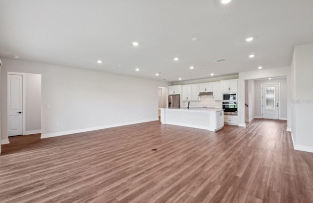 unfurnished living room with light wood-type flooring