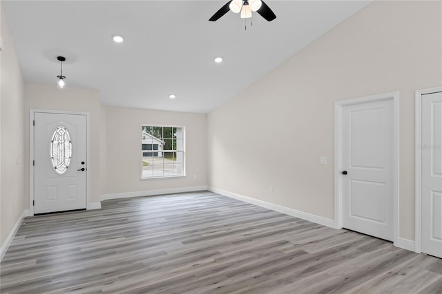 foyer entrance with light hardwood / wood-style flooring and ceiling fan