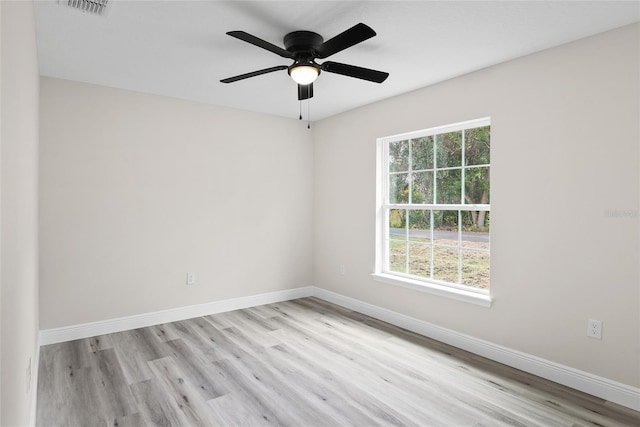 unfurnished room with ceiling fan, light hardwood / wood-style floors, and a healthy amount of sunlight