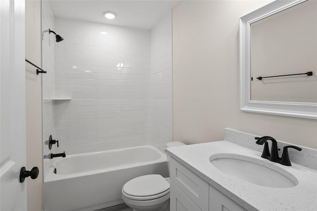 full bathroom with vanity, washtub / shower combination, and toilet