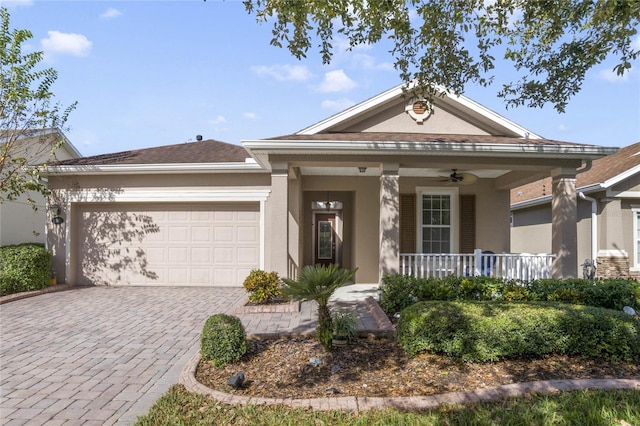 view of front of property with a porch and a garage