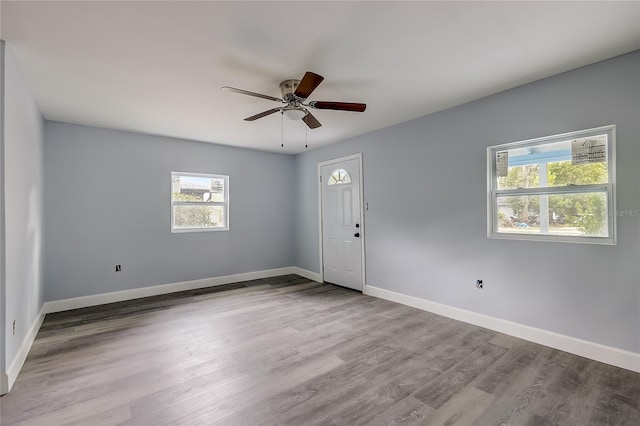 unfurnished room featuring ceiling fan and light hardwood / wood-style flooring