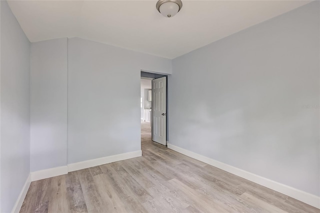 spare room with light wood-type flooring