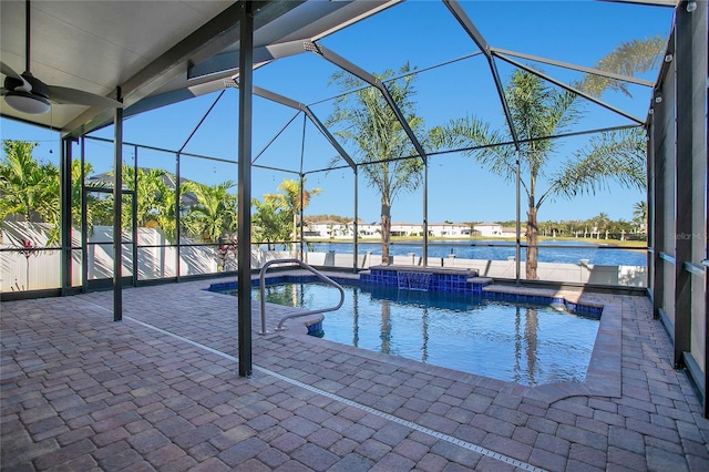 view of pool featuring a patio area, ceiling fan, and glass enclosure