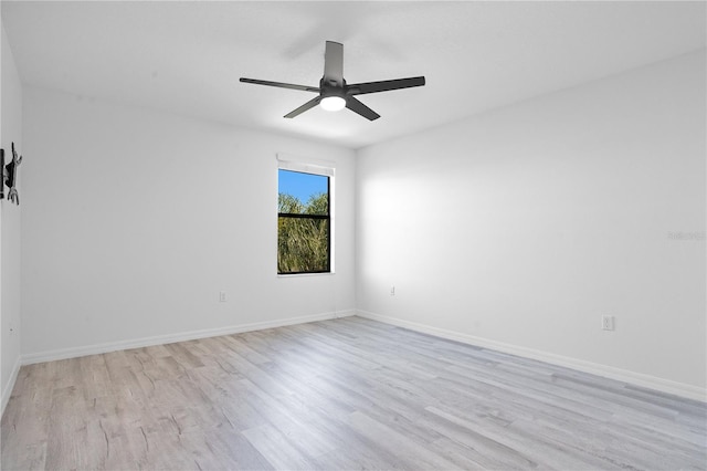 empty room with ceiling fan and light wood-type flooring