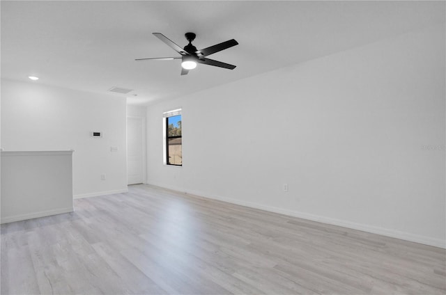 spare room with ceiling fan and light hardwood / wood-style flooring