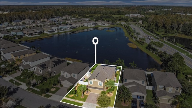 birds eye view of property featuring a water view