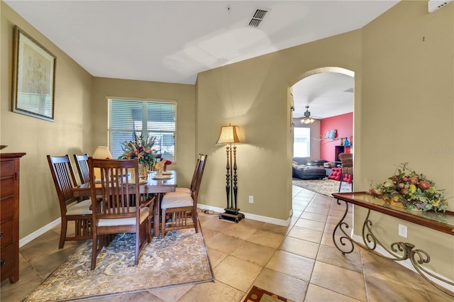 dining room with ceiling fan and light tile patterned floors