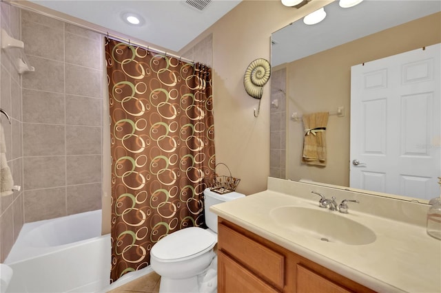 full bathroom featuring toilet, tile patterned floors, vanity, and shower / tub combo with curtain