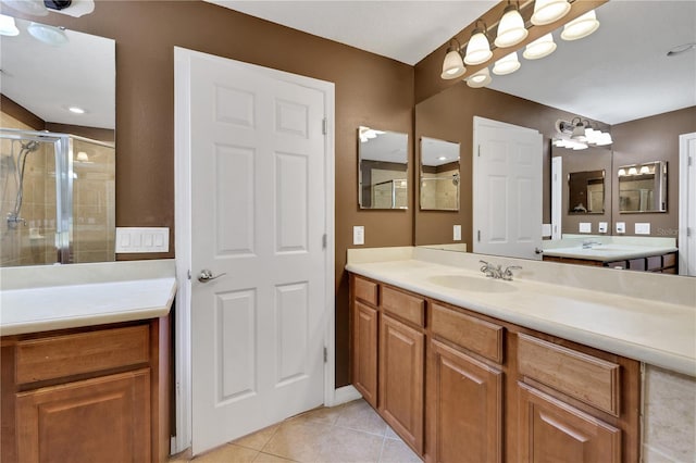 bathroom with vanity, tile patterned floors, and walk in shower