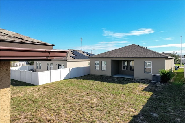 back of house with a yard