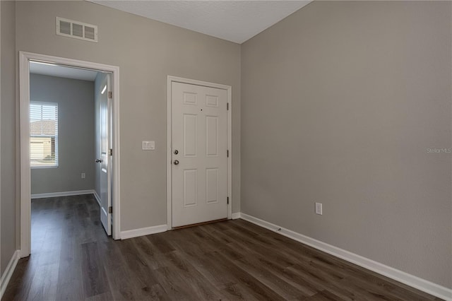 interior space with dark wood-type flooring