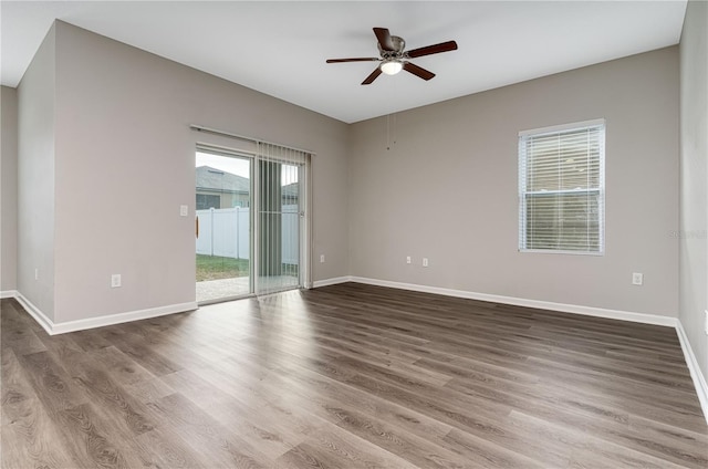 spare room with ceiling fan and hardwood / wood-style flooring