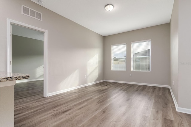 unfurnished room featuring wood-type flooring