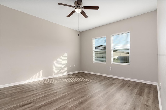 spare room featuring ceiling fan and hardwood / wood-style floors