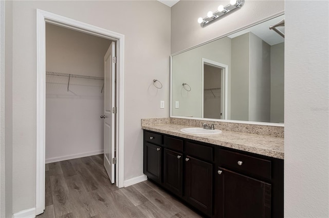 bathroom featuring vanity and hardwood / wood-style flooring