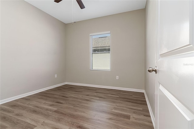 empty room featuring wood-type flooring and ceiling fan