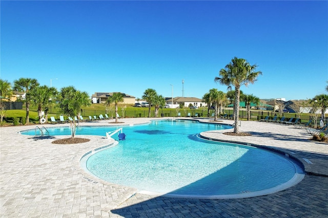 view of swimming pool featuring a patio