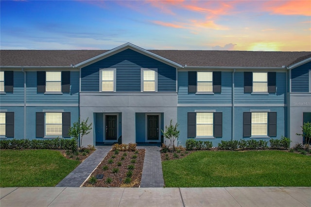 view of front of property with a yard