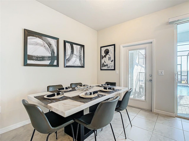 tiled dining room featuring a wealth of natural light