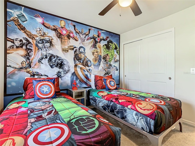 bedroom featuring carpet flooring, ceiling fan, and a closet