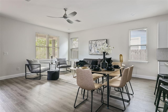 dining room featuring light hardwood / wood-style flooring and ceiling fan