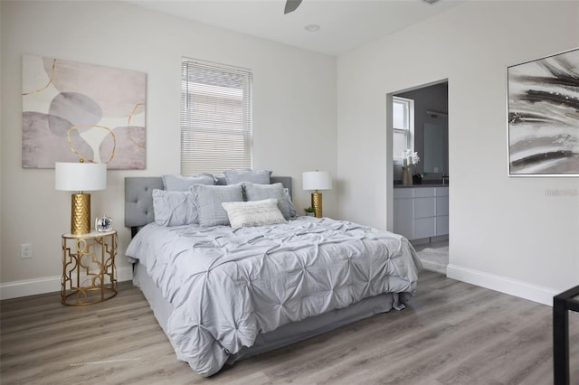 bedroom featuring ceiling fan and wood-type flooring