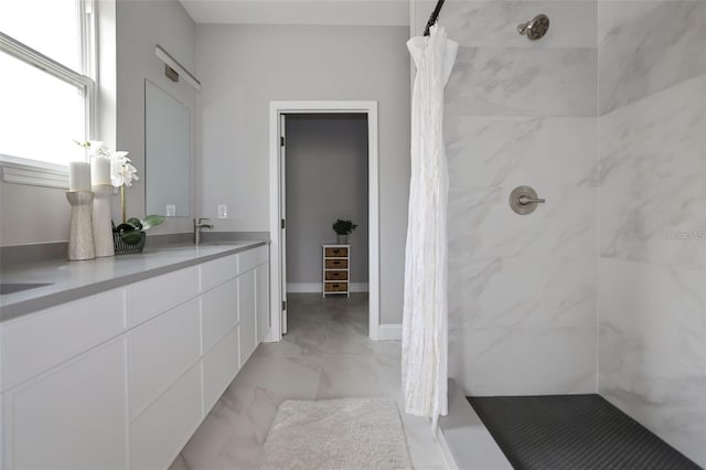 bathroom with vanity and walk in shower