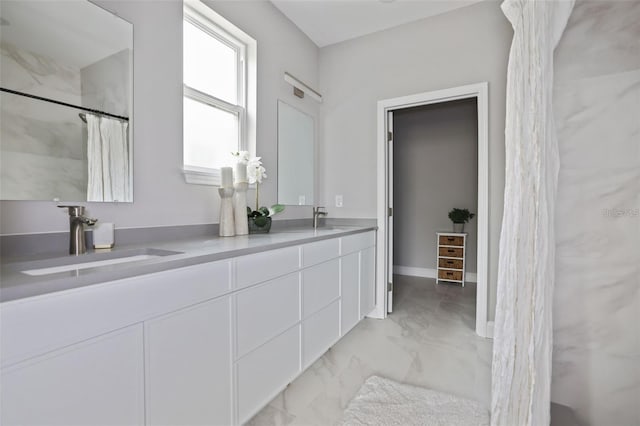 bathroom featuring vanity and walk in shower