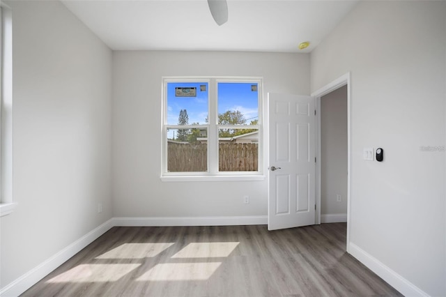 spare room with ceiling fan and light hardwood / wood-style floors