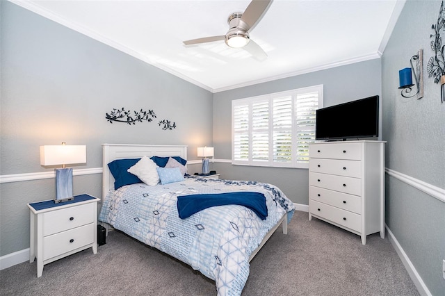 carpeted bedroom with ceiling fan and ornamental molding