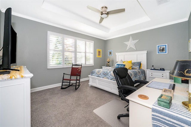 bedroom with carpet flooring, ceiling fan, a raised ceiling, and crown molding