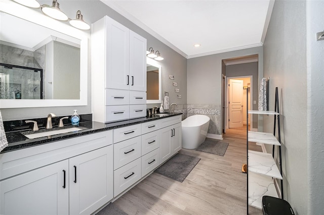 bathroom featuring separate shower and tub, crown molding, vanity, and wood-type flooring