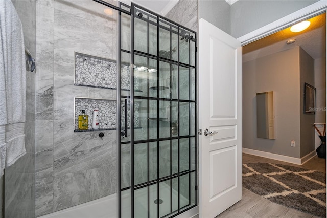 bathroom with hardwood / wood-style flooring