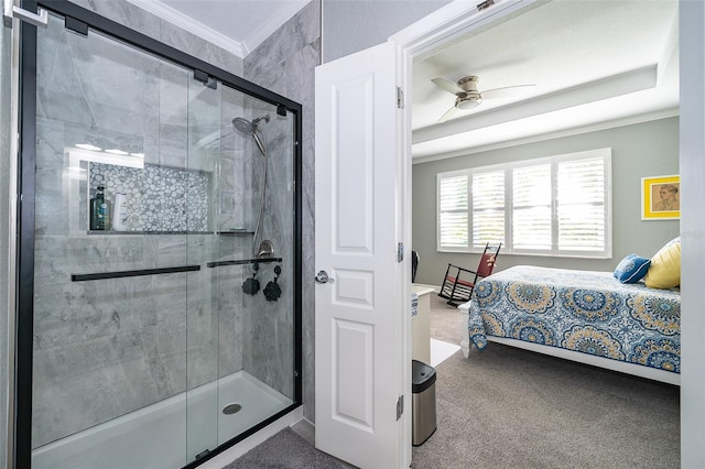 bathroom featuring ornamental molding, ceiling fan, and a shower with shower door