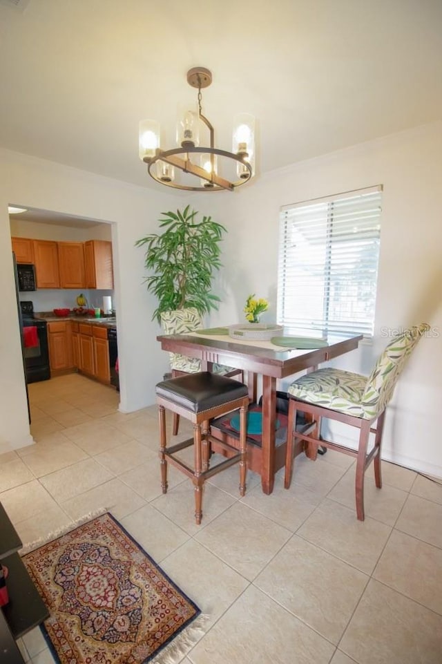 dining area featuring light tile patterned floors and an inviting chandelier