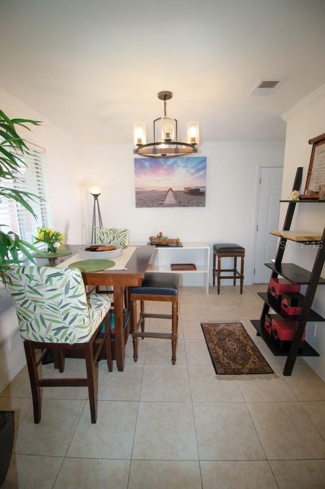 living area with an inviting chandelier and light tile patterned flooring