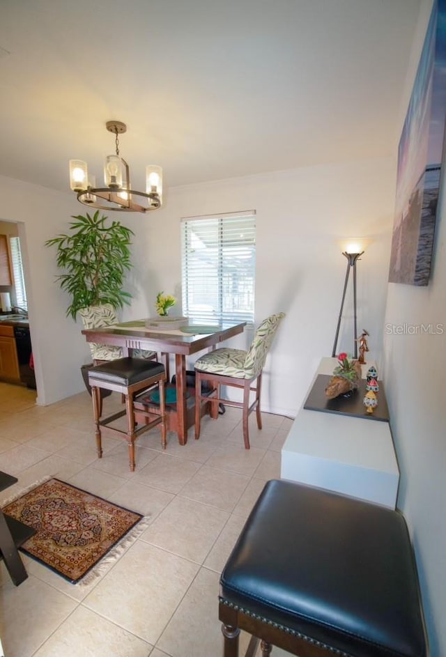 dining area with a notable chandelier and light tile patterned floors